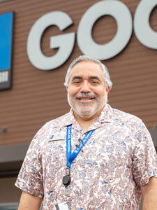 Goodwill San Antonio manager, male, printed button down