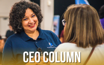 Photo of Goodwill San Antonio employee discussing career opportunities to job seeker.