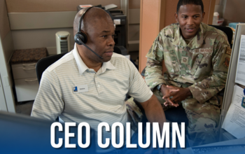 Veteran and active duty members of the U.S. Air Force work together on a computer at Goodwill San Antonio's Randolph Brooks Air Force Base Business Services call center.