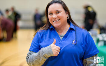 goodwill team member with thumbs up