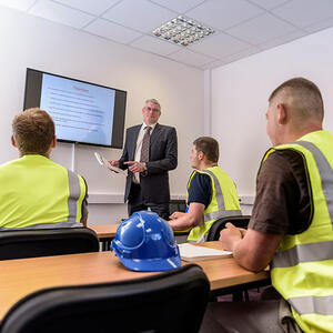 workers being taught in a classroom setting